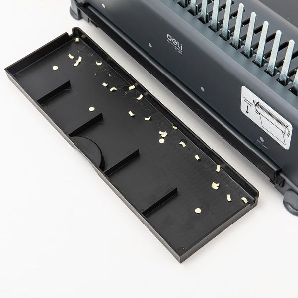 Black paper puncher with a clear plastic sheet on a white background